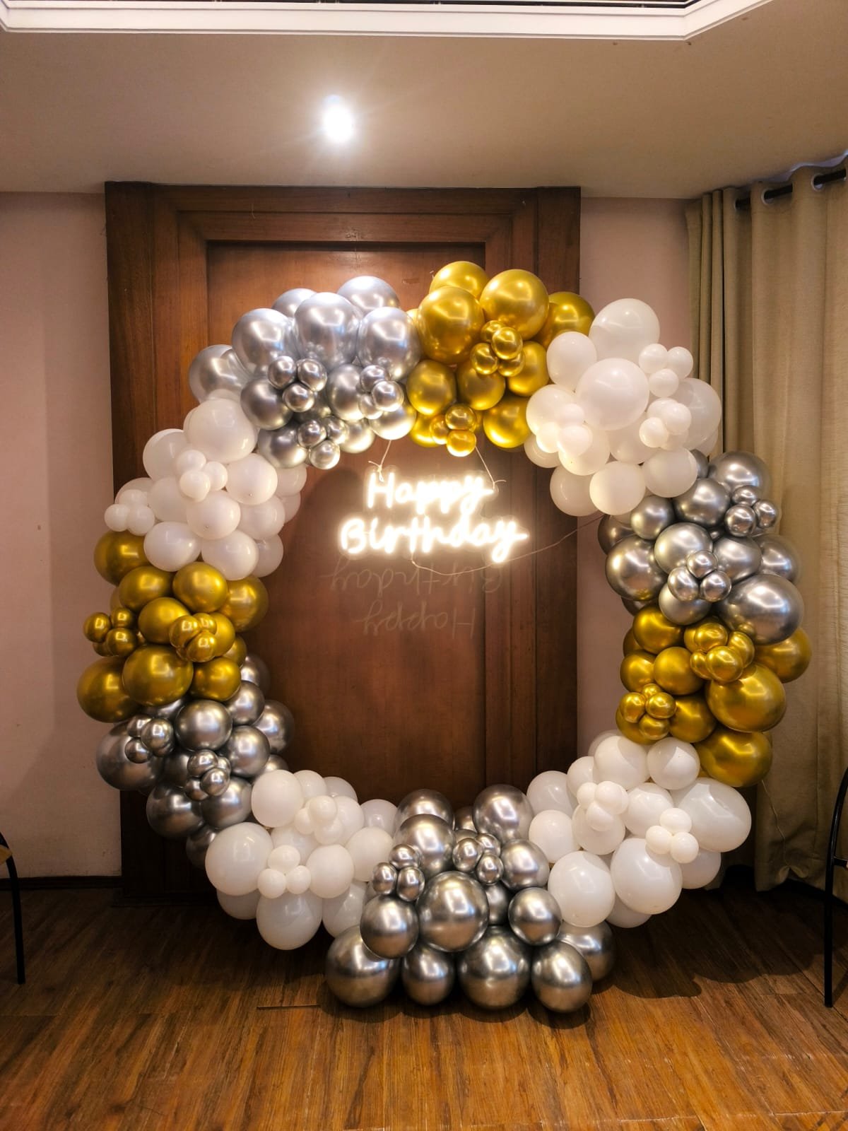 Gold, silver and white balloon ring arch decoration crafted by Star Balloon Mumbai