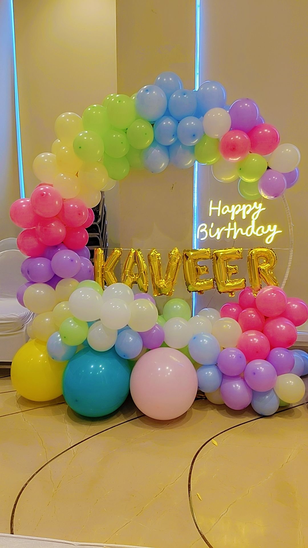 Pastel rainbow balloon ring with neon sign festive decoration by Star Balloon Mumbai